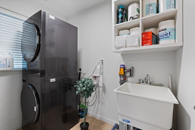 1071 N Sherman Dr Unit B, Royal Oak, MI 48067 - laundry area with stacked washer / drying machine and baseboards