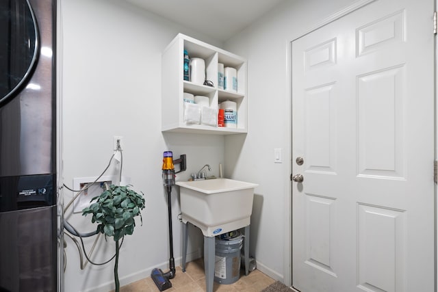 1071 N Sherman Dr Unit B, Royal Oak, MI 48067 - laundry room with baseboards and light tile patterned floors