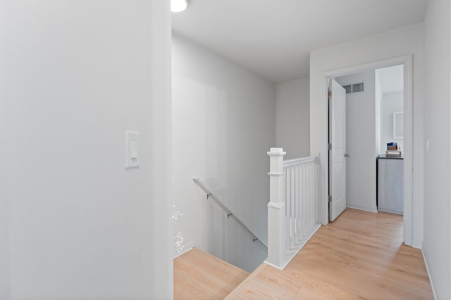 1071 N Sherman Dr Unit B, Royal Oak, MI 48067 - hallway with an upstairs landing, light wood-type flooring, and baseboards
