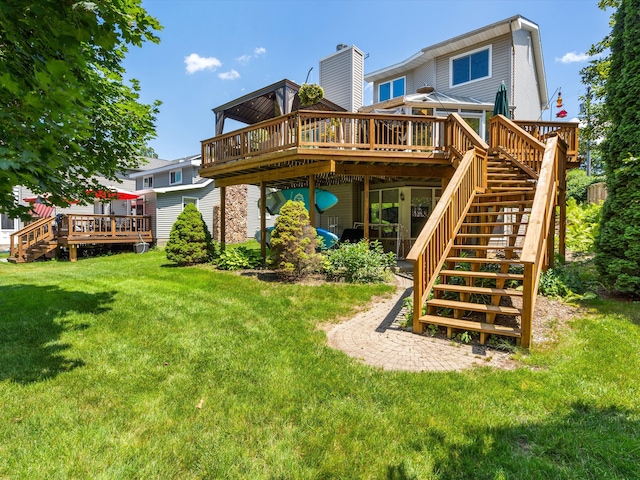 3097 Lansdowne Rd, Waterford, MI 48329 - back of property with a deck, stairs, and a lawn