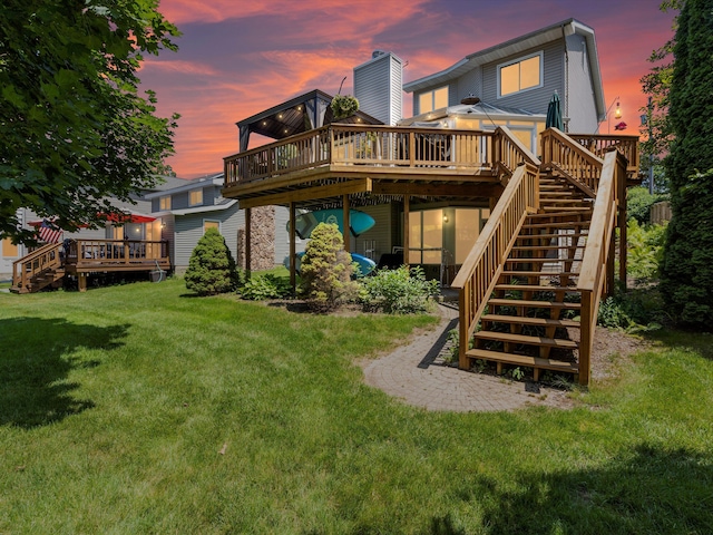 3097 Lansdowne Rd, Waterford, MI 48329 - back of property featuring a wooden deck, stairs, and a yard