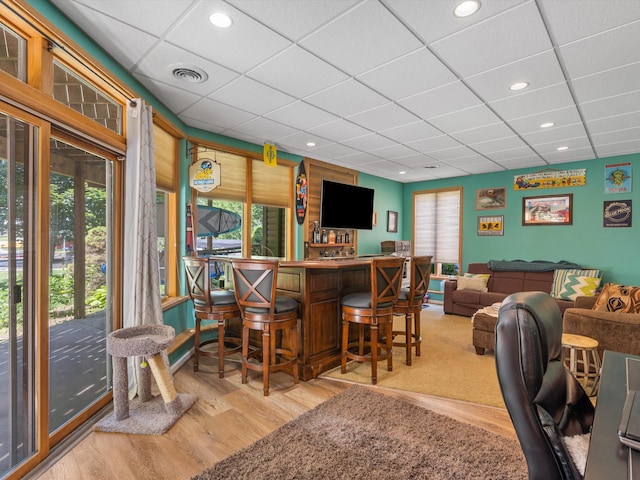 3097 Lansdowne Rd, Waterford, MI 48329 - indoor dry bar with a paneled ceiling and light wood-style floors