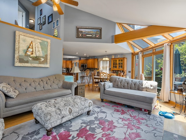 3097 Lansdowne Rd, Waterford, MI 48329 - living room featuring light wood finished floors, a ceiling fan, and high vaulted ceiling