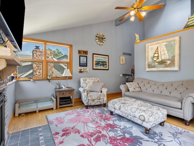 3097 Lansdowne Rd, Waterford, MI 48329 - living room featuring a fireplace, ceiling fan, wood finished floors, and high vaulted ceiling