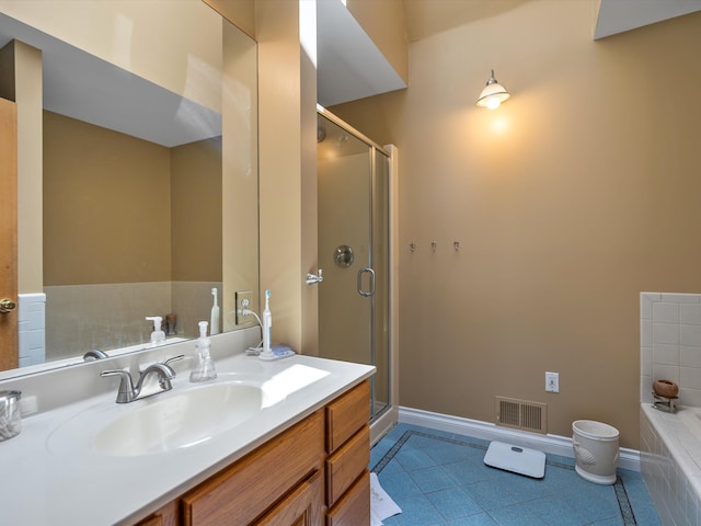 3097 Lansdowne Rd, Waterford, MI 48329 - bathroom with baseboards, vanity, a garden tub, a stall shower, and tile patterned floors