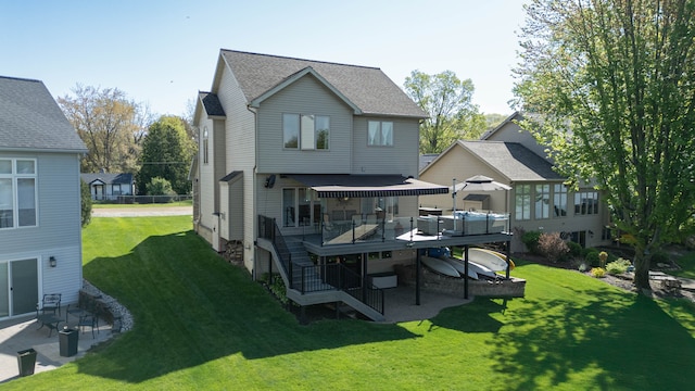 16018 Moran Dr, Linden, MI 48451 - back of property with a yard, a deck, and roof with shingles