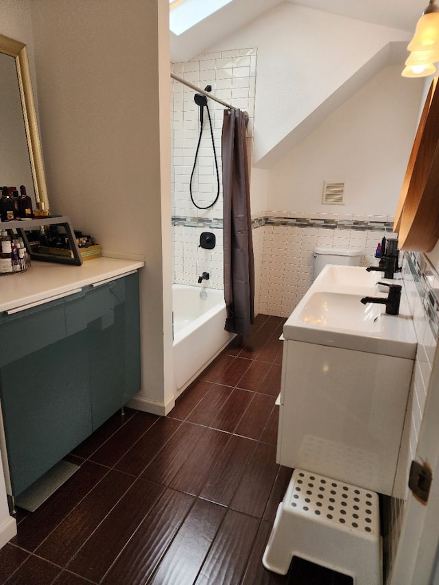 2713 Trowbridge St, Hamtramck, MI 48212 - bathroom featuring washer / dryer, shower / bath combination with curtain, vanity, lofted ceiling, and tile walls