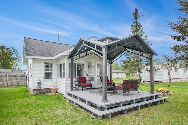 116 Alma Ln, Houghton Lake, MI 48629 - rear view of property with a wooden deck and roof with shingles