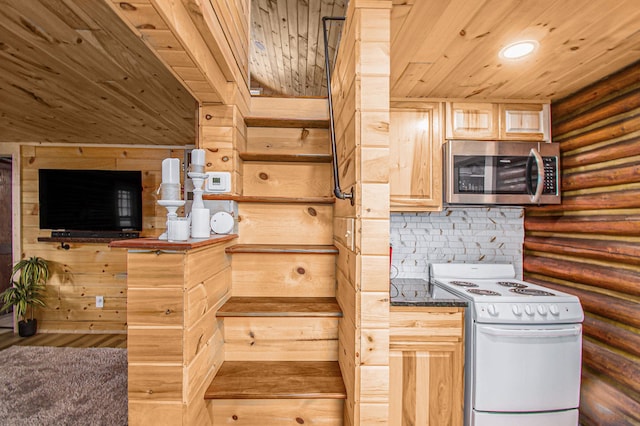 116 Alma Ln, Houghton Lake, MI 48629 - kitchen featuring stainless steel microwave, wooden ceiling, white range with electric stovetop, light brown cabinetry, and log walls