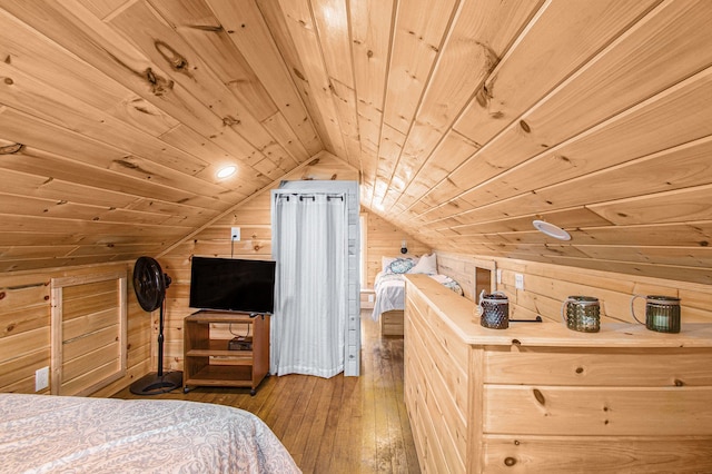 116 Alma Ln, Houghton Lake, MI 48629 - bedroom with wooden ceiling, wood walls, vaulted ceiling, and hardwood / wood-style floors