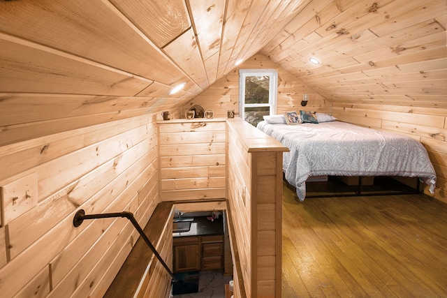 116 Alma Ln, Houghton Lake, MI 48629 - bedroom featuring wooden walls, wood-type flooring, vaulted ceiling, and wood ceiling