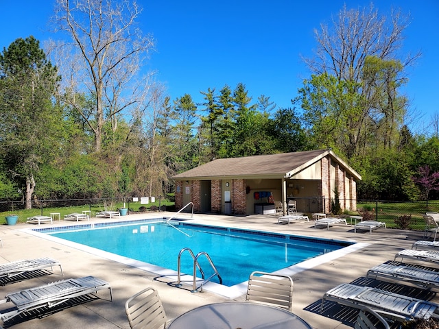 7215 Suncrest Rd, West Bloomfield, MI 48322 - community pool with fence, a patio, and view of scattered trees