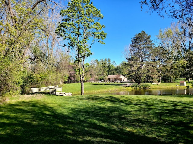 7215 Suncrest Rd, West Bloomfield, MI 48322 - view of grassy yard with a water view