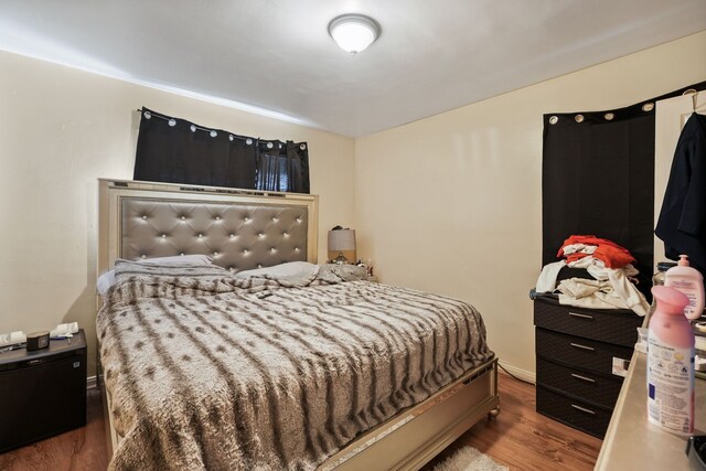 bedroom with wood finished floors