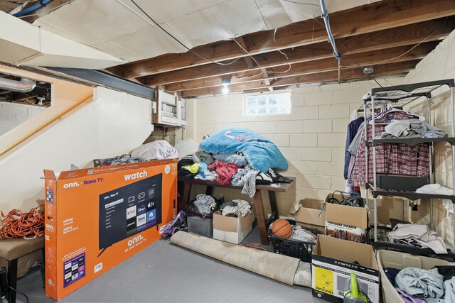 basement featuring concrete block wall