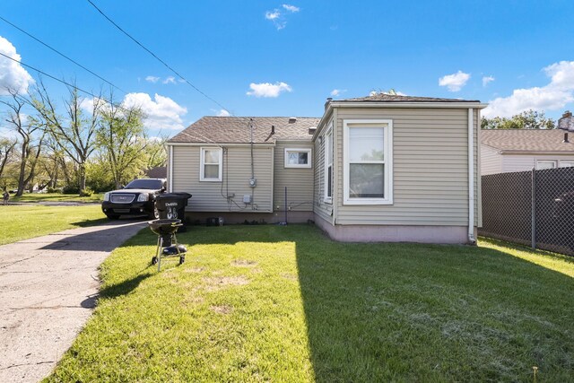 back of property with concrete driveway