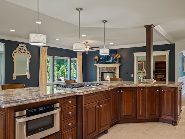 680 Pear Tree Ln, Grosse Pointe Woods, MI 48236 - kitchen with appliances with stainless steel finishes, a glass covered fireplace, crown molding, open floor plan, and recessed lighting
