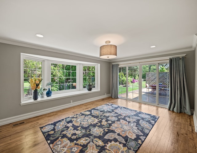 680 Pear Tree Ln, Grosse Pointe Woods, MI 48236 - spare room with crown molding, plenty of natural light, hardwood / wood-style floors, and recessed lighting