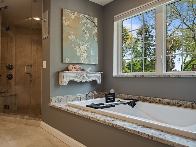680 Pear Tree Ln, Grosse Pointe Woods, MI 48236 - bathroom with a shower stall, tile patterned floors, a bath, and baseboards