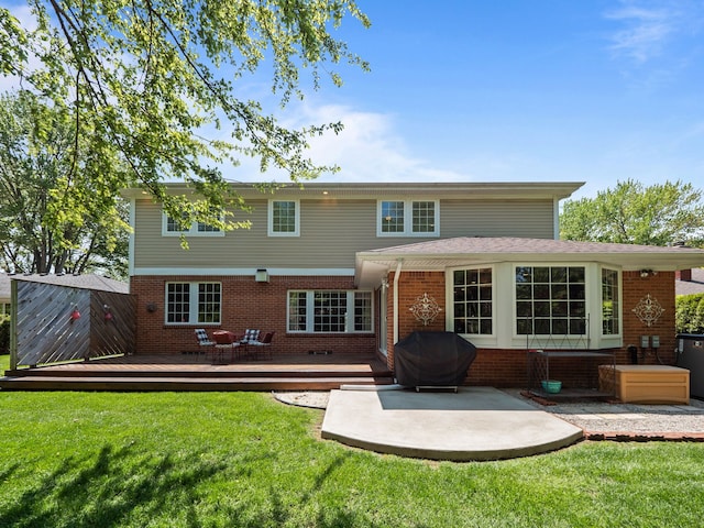 680 Pear Tree Ln, Grosse Pointe Woods, MI 48236 - rear view of house with brick siding, a wooden deck, a yard, and a patio