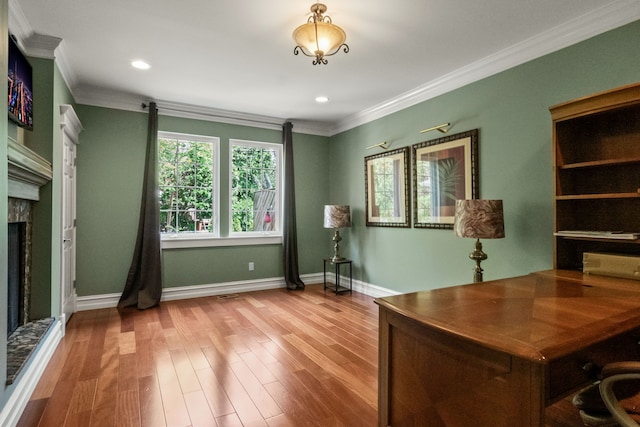 680 Pear Tree Ln, Grosse Pointe Woods, MI 48236 - office featuring ornamental molding, a fireplace with raised hearth, wood finished floors, baseboards, and recessed lighting