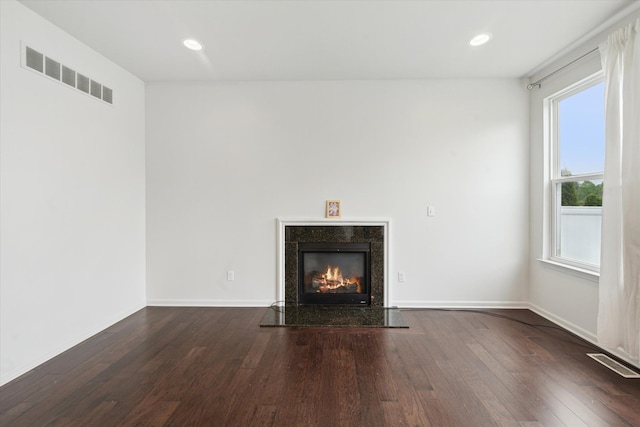 3236 Curtis, Wixom, MI 48393 - unfurnished living room featuring dark wood-style flooring, a premium fireplace, recessed lighting, and baseboards