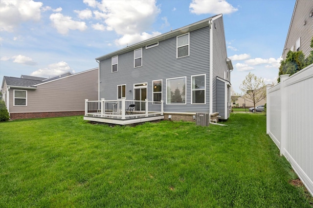 3236 Curtis, Wixom, MI 48393 - back of property with a wooden deck, a lawn, and central AC unit