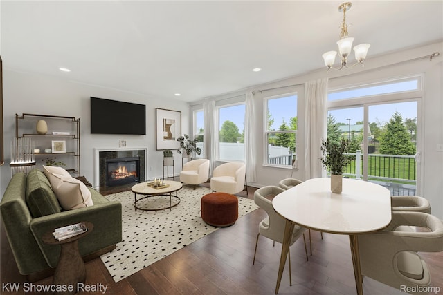 3236 Curtis, Wixom, MI 48393 - living area featuring wood finished floors, healthy amount of natural light, a chandelier, a fireplace, and recessed lighting