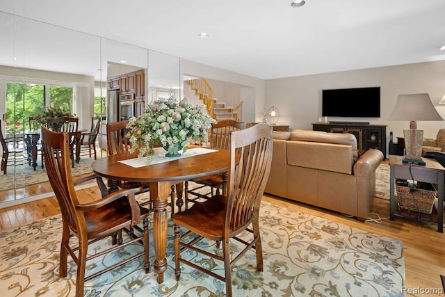 5117 Woodview Ct, Dearborn, MI 48126 - dining area with light wood-style flooring, stairs, and recessed lighting