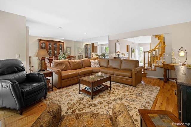 5117 Woodview Ct, Dearborn, MI 48126 - living room featuring light wood-style flooring and stairs