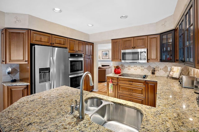 5117 Woodview Ct, Dearborn, MI 48126 - kitchen featuring stainless steel appliances, a sink, light stone countertops, and recessed lighting