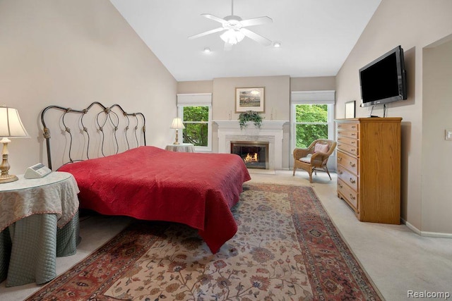 5117 Woodview Ct, Dearborn, MI 48126 - bedroom featuring vaulted ceiling, light colored carpet, multiple windows, baseboards, and a premium fireplace