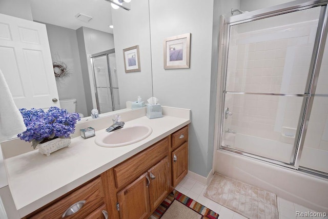 5117 Woodview Ct, Dearborn, MI 48126 - bathroom with vanity, toilet, combined bath / shower with glass door, and tile patterned flooring