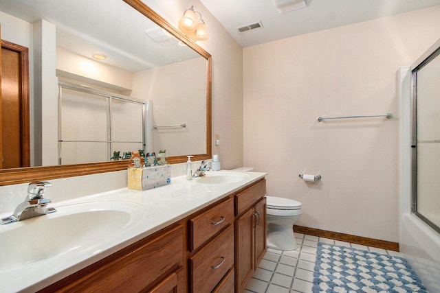 14965 Loon Lake Dr, Bellevue, MI 49021 - full bath featuring toilet, baseboards, double vanity, and tile patterned floors