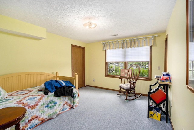 14965 Loon Lake Dr, Bellevue, MI 49021 - carpeted bedroom with a textured ceiling and baseboards