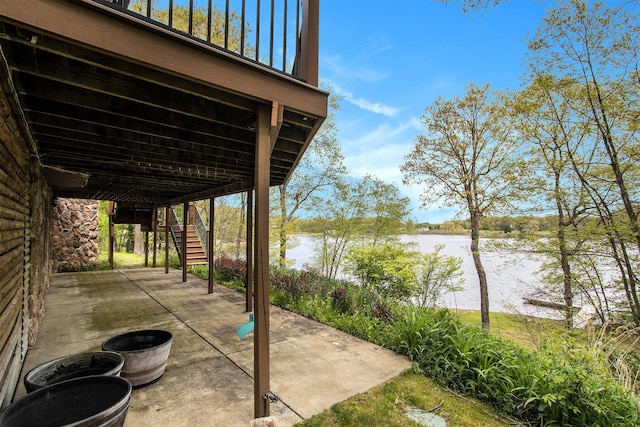 14965 Loon Lake Dr, Bellevue, MI 49021 - view of patio / terrace with stairs and a water view