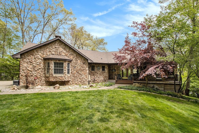 14965 Loon Lake Dr, Bellevue, MI 49021 - view of front of house with stone siding, a chimney, a front yard, and a shingled roof