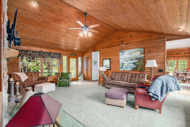 14965 Loon Lake Dr, Bellevue, MI 49021 - living room with vaulted ceiling, wood walls, wood ceiling, ceiling fan, and carpet floors