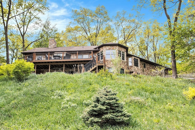 14965 Loon Lake Dr, Bellevue, MI 49021 - back of house featuring a deck, a chimney, stairway, and stone siding