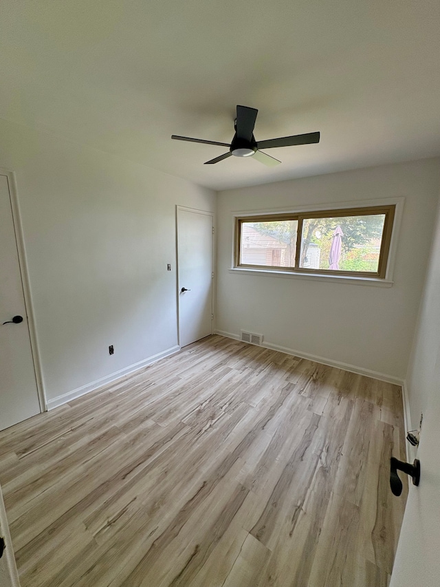 9988 Stout St, Detroit, MI 48228 - spare room with light wood-style flooring, a ceiling fan, and baseboards