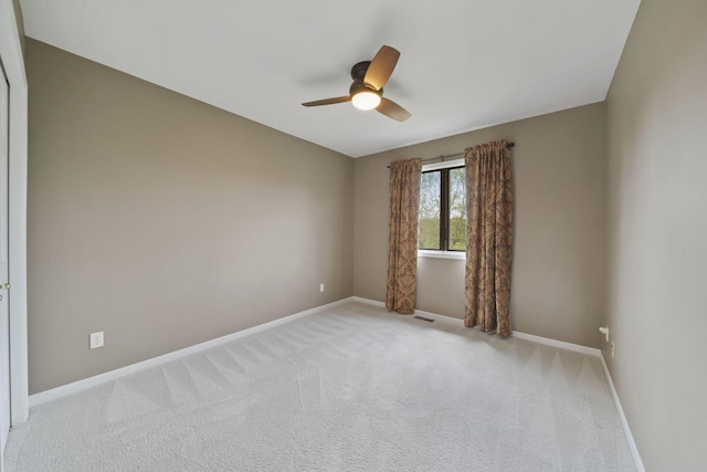 1287 Deer Run, Grass Lake, MI 49240 - empty room with baseboards, a ceiling fan, and light carpet
