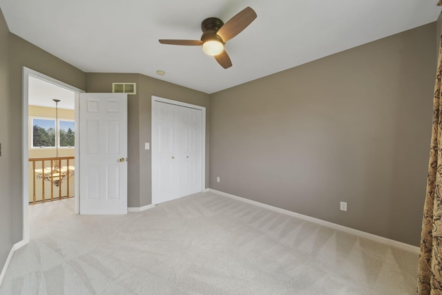 1287 Deer Run, Grass Lake, MI 49240 - unfurnished bedroom featuring light carpet, baseboards, a closet, and ceiling fan