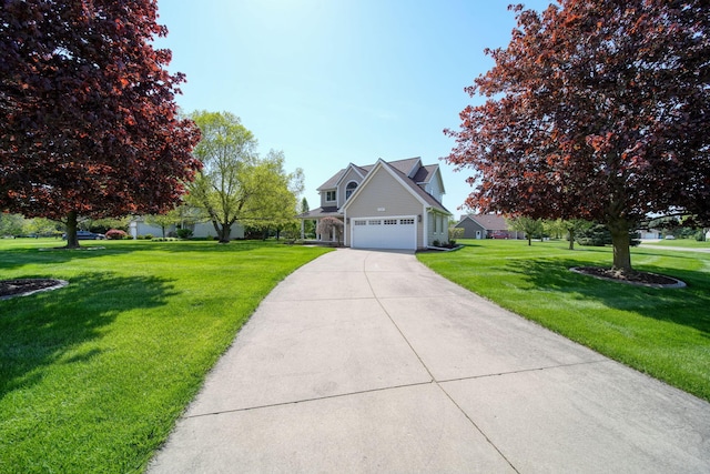 1287 Deer Run, Grass Lake, MI 49240 - view of front of home with a front yard, concrete driveway, and an attached garage