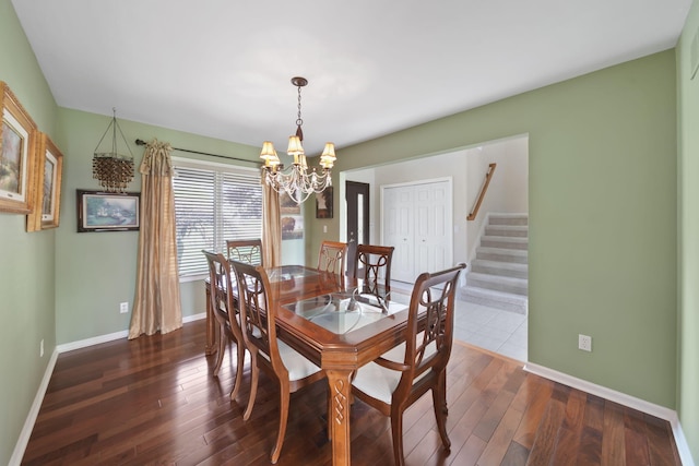 1287 Deer Run, Grass Lake, MI 49240 - dining space with a chandelier, stairs, baseboards, and dark wood finished floors
