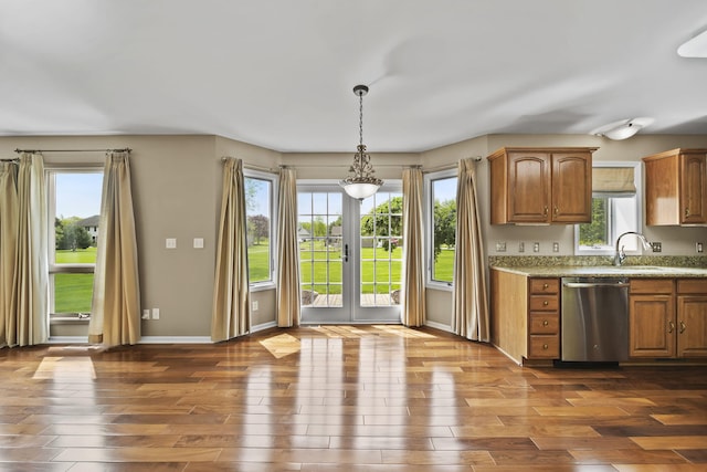 1287 Deer Run, Grass Lake, MI 49240 - kitchen with dishwasher, healthy amount of natural light, brown cabinetry, and dark wood-style floors