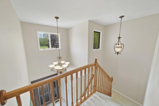 1287 Deer Run, Grass Lake, MI 49240 - staircase with a chandelier, carpet, and baseboards