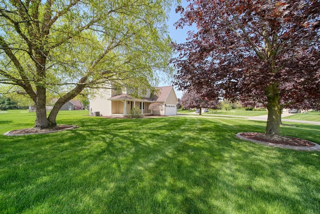 1287 Deer Run, Grass Lake, MI 49240 - view of green lawn featuring a garage