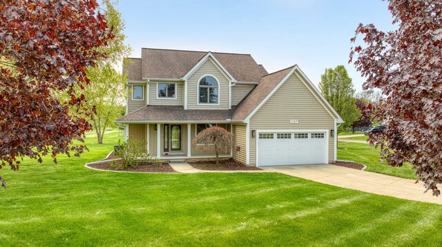 1287 Deer Run, Grass Lake, MI 49240 - traditional-style house with concrete driveway, roof with shingles, a front lawn, and an attached garage