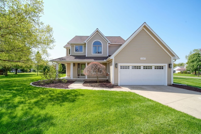 1287 Deer Run, Grass Lake, MI 49240 - view of front facade with driveway, covered porch, a front lawn, and a garage
