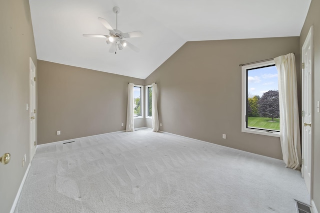 1287 Deer Run, Grass Lake, MI 49240 - spare room with a ceiling fan, vaulted ceiling, baseboards, and light carpet